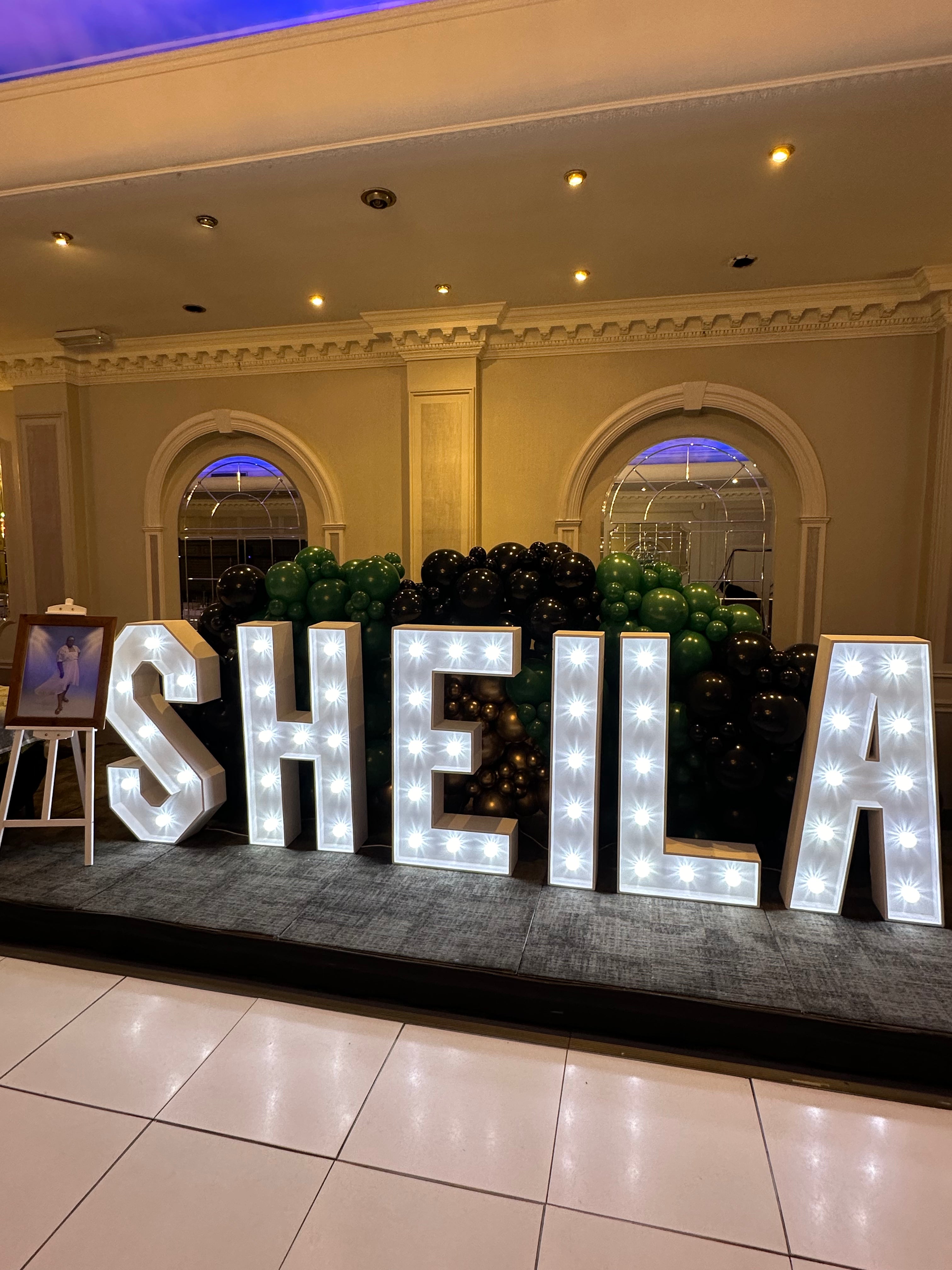 Organic balloon wall for LED light up letters marquee.