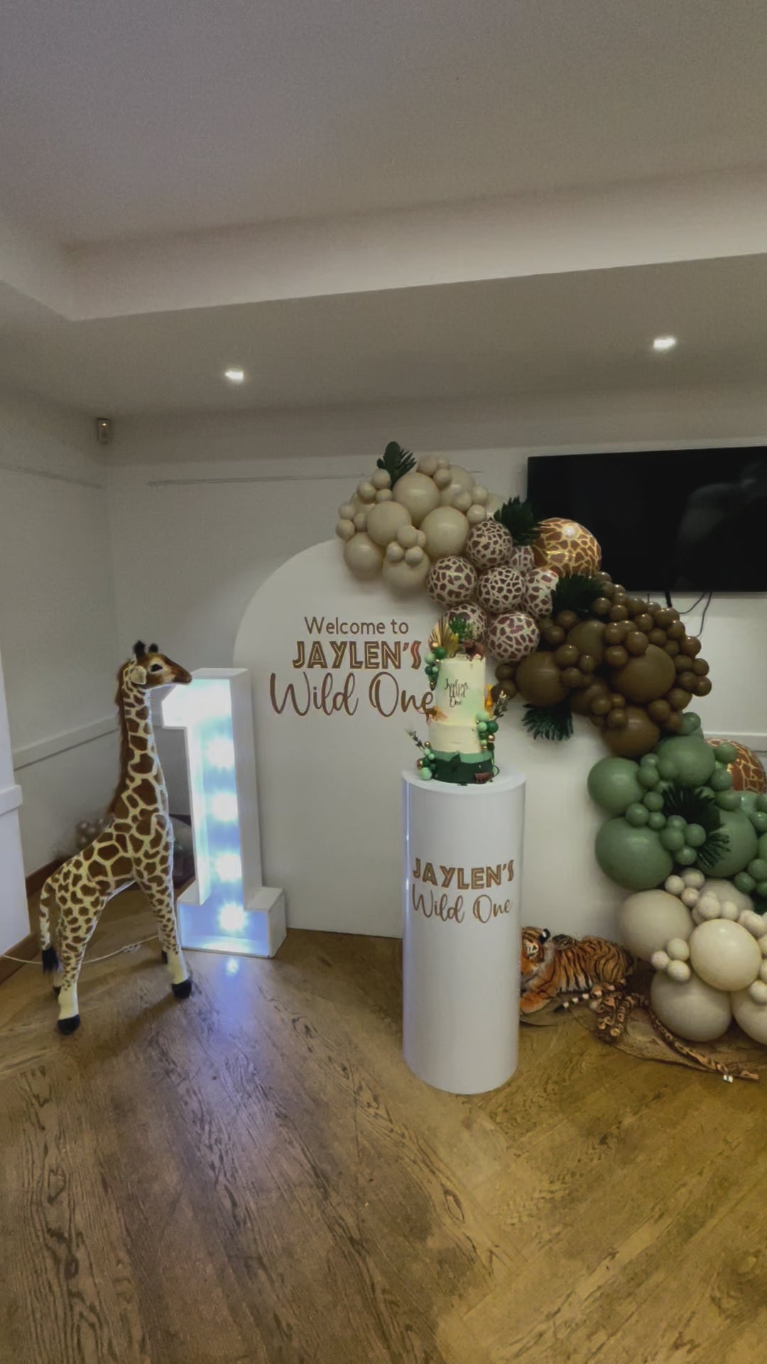 Children's first birthday safari decoration with safari theme decoration with cake plinth